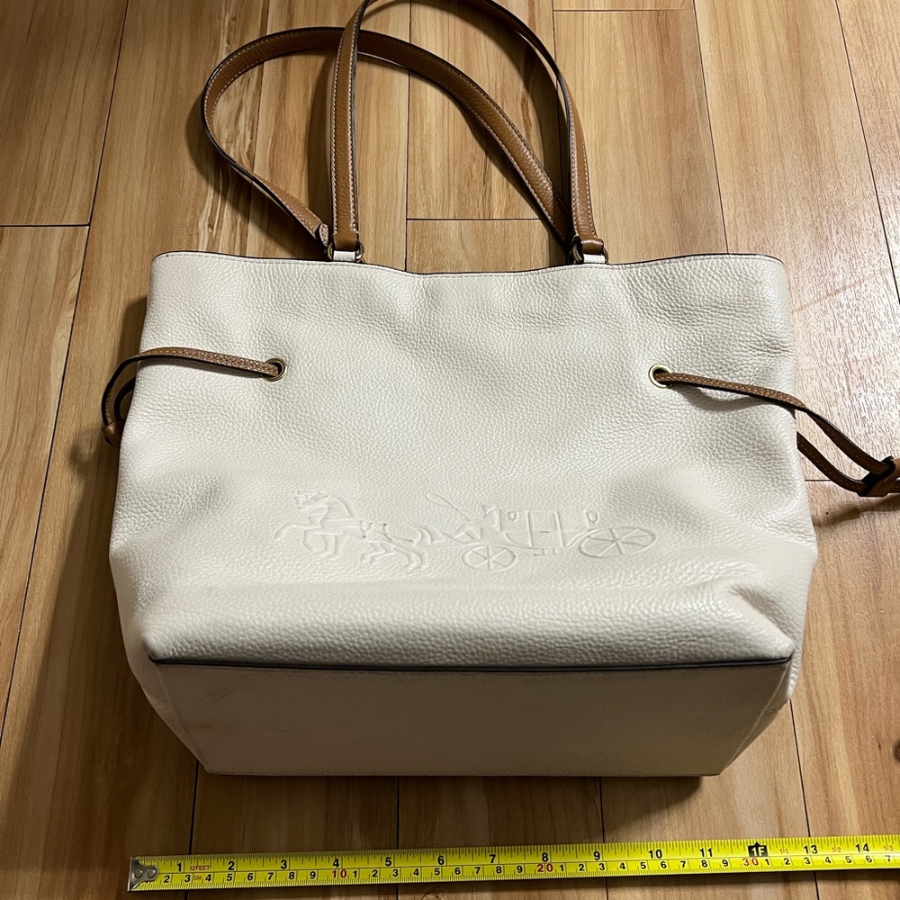White and tan Coach purse and matching wallet